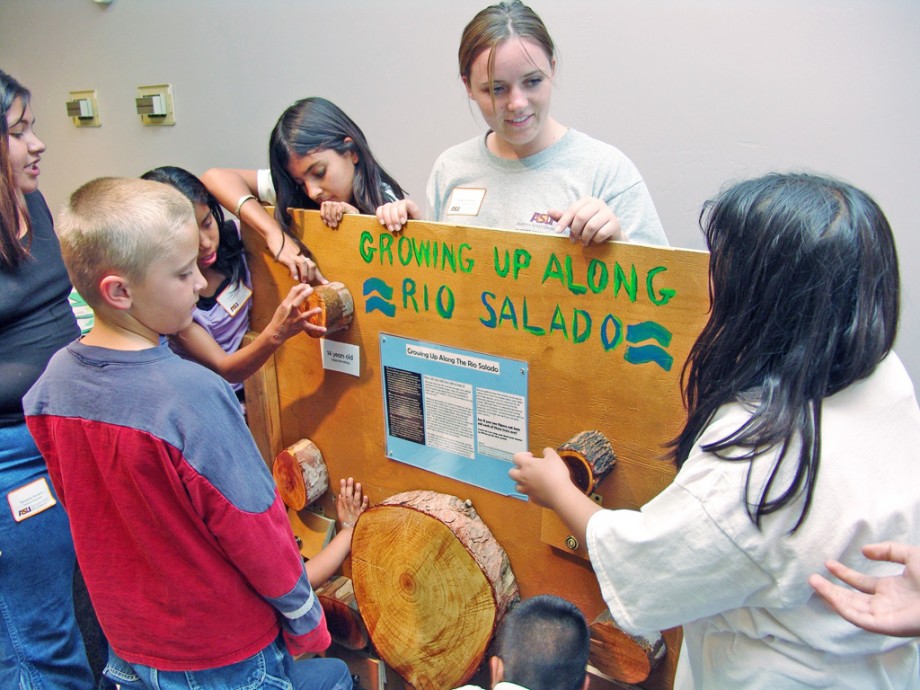 Students admire exhibit created by Service at Salado after school club. 