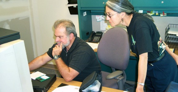 David Blankman helps Sonia Ortega set up her computer as she gets settled