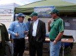 Mike Antolin (left) and Jim Detling (right) talk to Larry Penley (center)