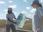 Florida Coastal Everglades, where researchers are shown here explaining aspects 