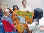 Students admire exhibit created by Service at Salado after school club. 