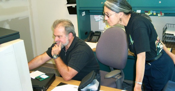 David Blankman helps Sonia Ortega set up her computer as she gets settled