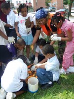 Baltimore Ecosystem Study’s Quin Holifield studies soil with school children.